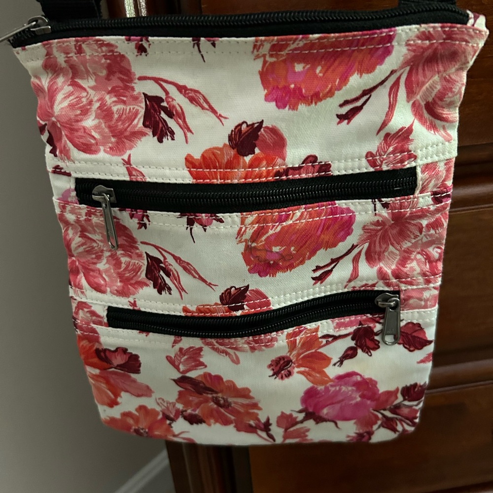 NWOT pink and white flowered cross body/shoulder bag. 
brand new!